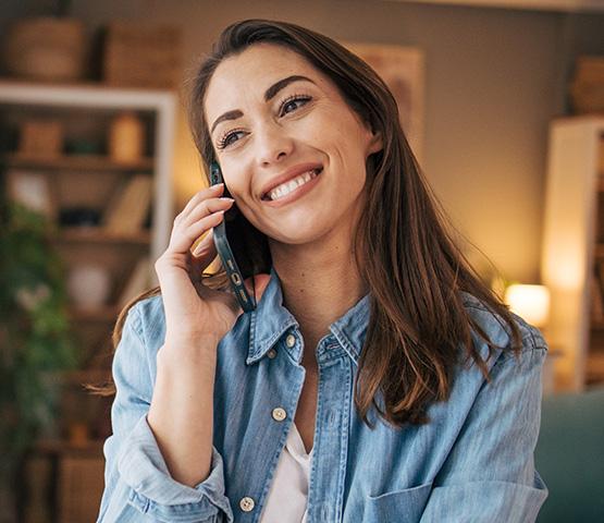 smiling woman on the phone