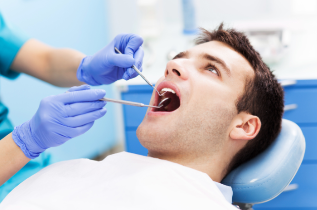 person sitting in dental chair