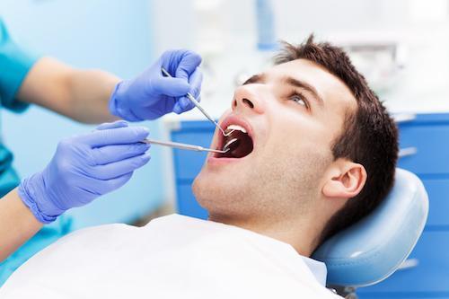 a man gets his teeth worked on | Humble TX gum disease treatment