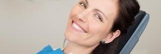 woman in dental chair smiling