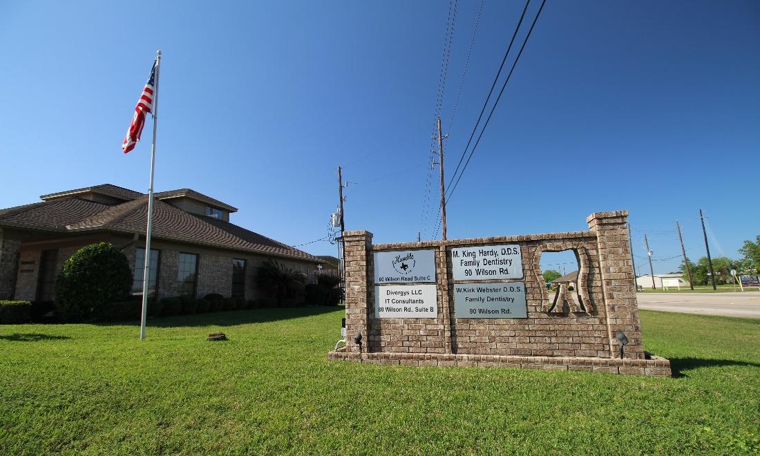 the front of our office and our sign from outside | dentist in humble tx